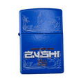 Blue Zushi x Zippo lighter close up showing matte blue case with engraved wave design and white Zushi logo on front